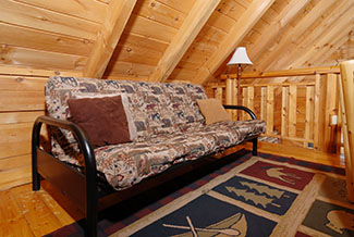 Pigeon Forge Cabin that features a futon by the card table
